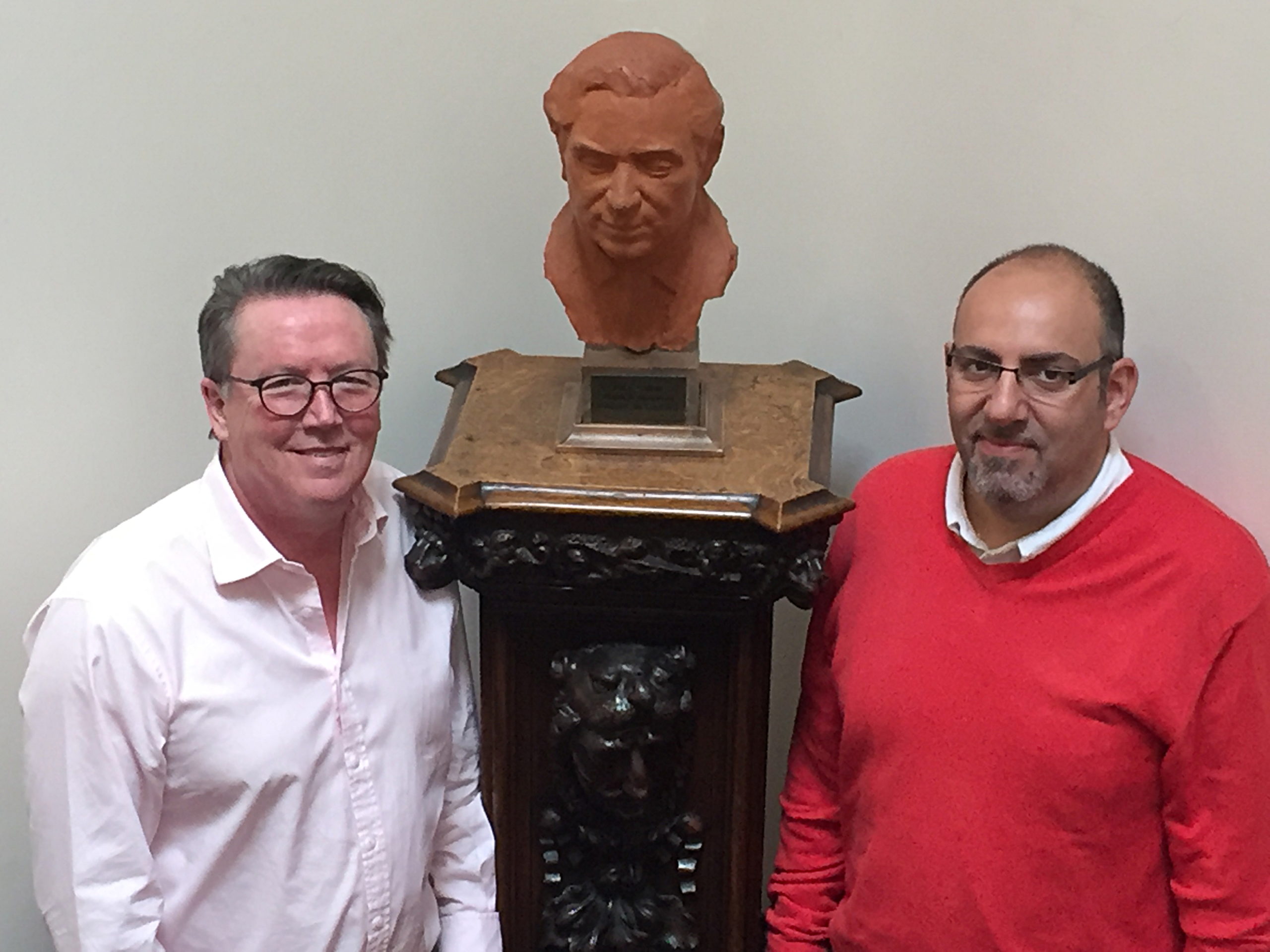 Mike Macnamee (left) and Thanos Papathanasiou (right) with bust of Patrick Steptoe at Bourn Hall. Bust of Patrick Steptoe at Bourn Hall Cambridge