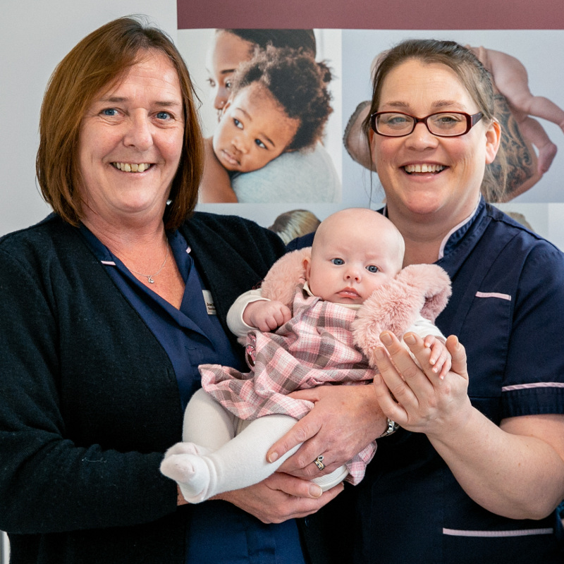 Fertility Nurse Specialists Jackie Richardson and Angela Leach with an Essex Bourn Hall baby Fertility Nurse Specialists Jackie Richardson and Angela Leach with an Essex Bourn Hall baby