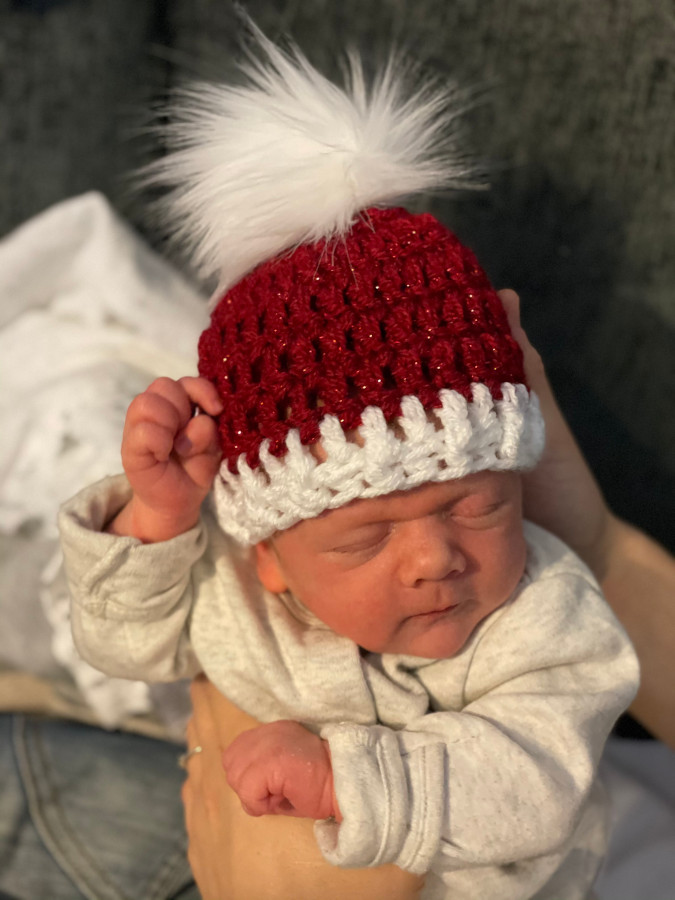 Baby Addison wearing a Christmas hat (web)