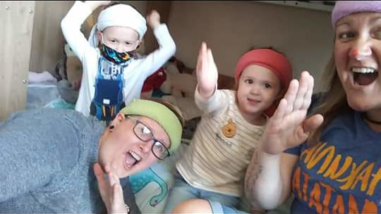 Mel and Laura having fun with their twins