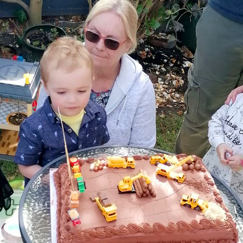 Bear and his grandmother with his birthday cake (web) Bear and his grandmother with his birthday cake